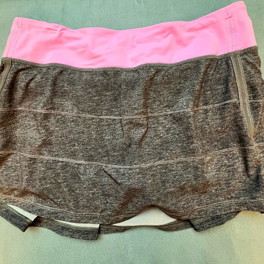 Lululemon vintage Grey with light pink band. Size 8.  Like new.